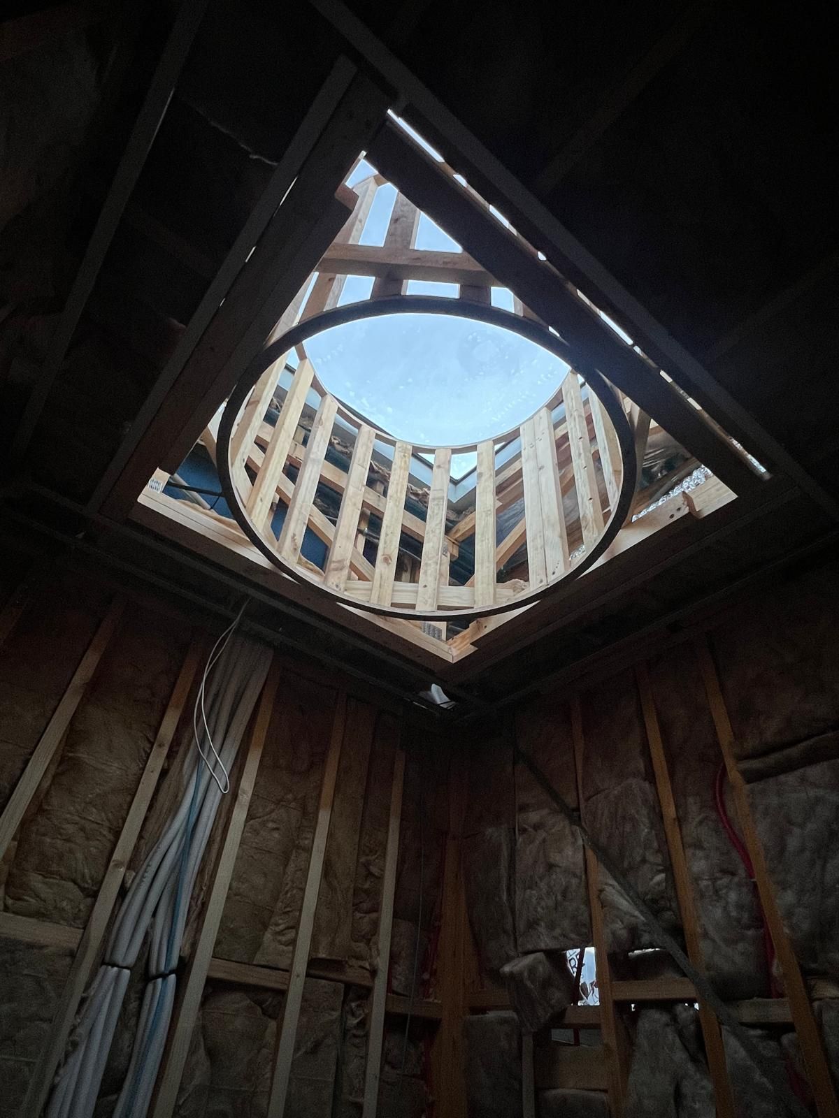 Timber framing of a circular turret void, viewed from below